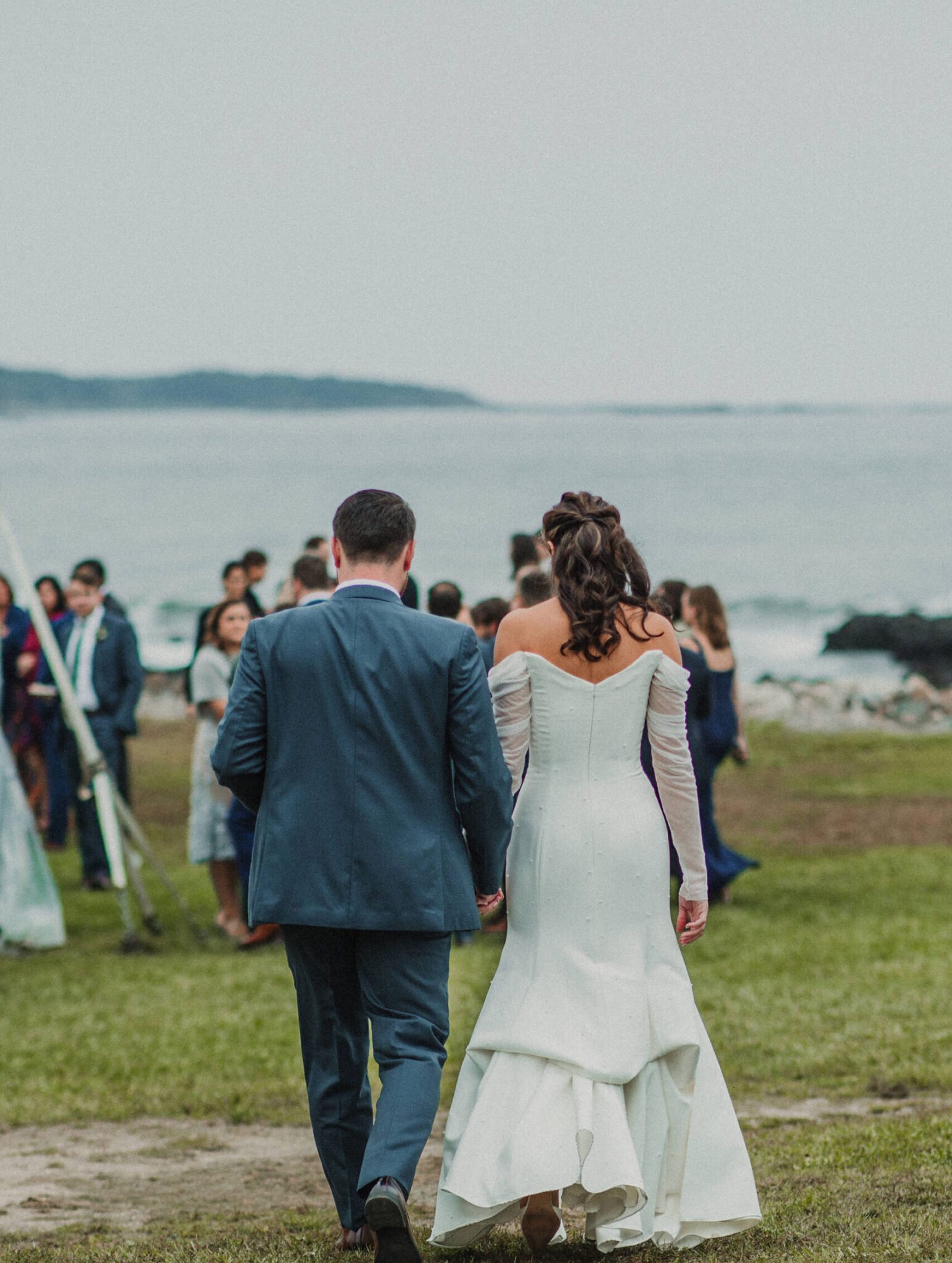 Bride and Groom walking into wedding reception
