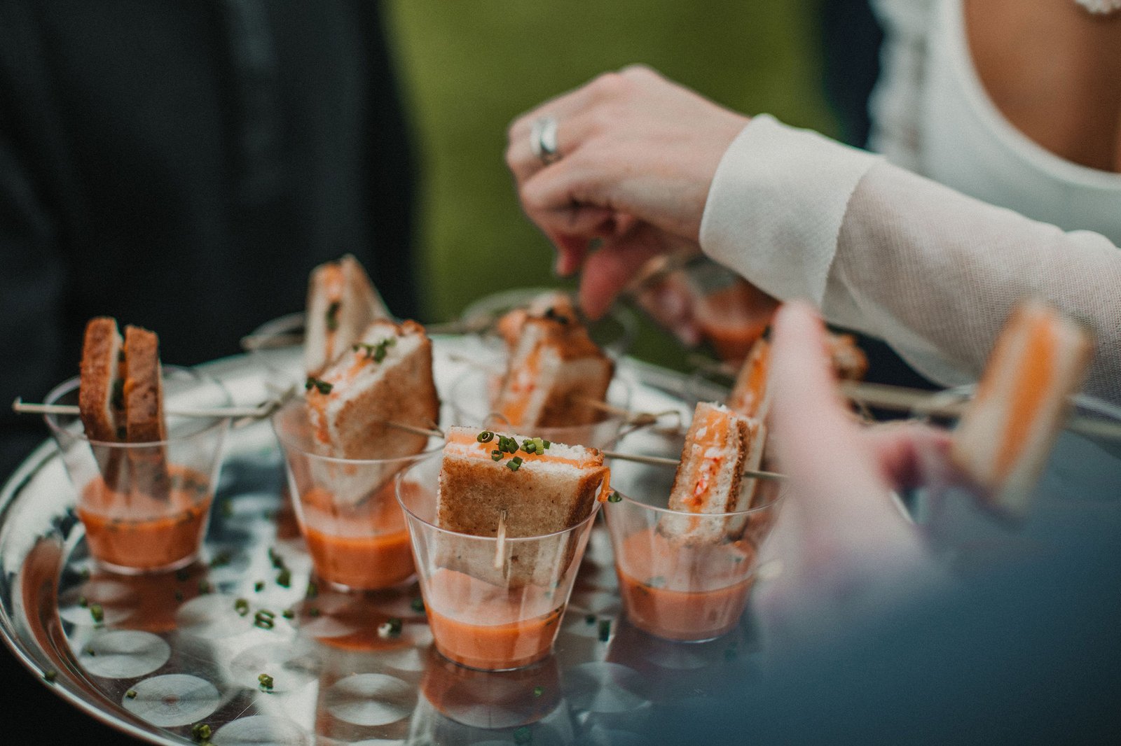 Bride enjoying cocktail hour appetizers